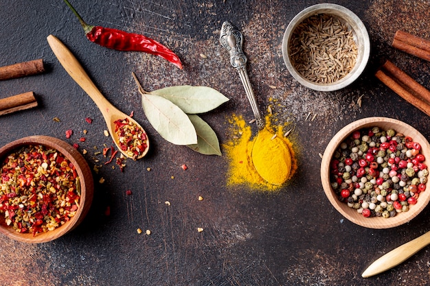 Top view of assortment of spices and cinnamon sticks