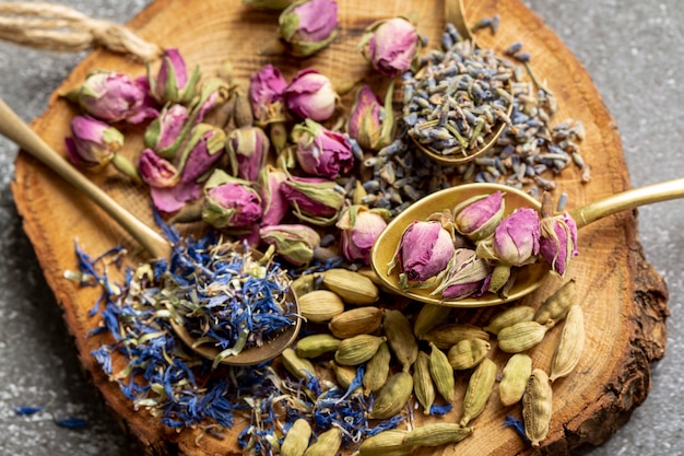 Top view of assortment of spices on wooden board