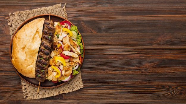 Top view of assortment of tasty kebabs and copy space