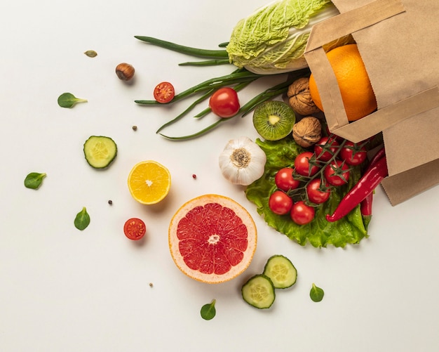 Top view of assortment of vegetables in grocery bag