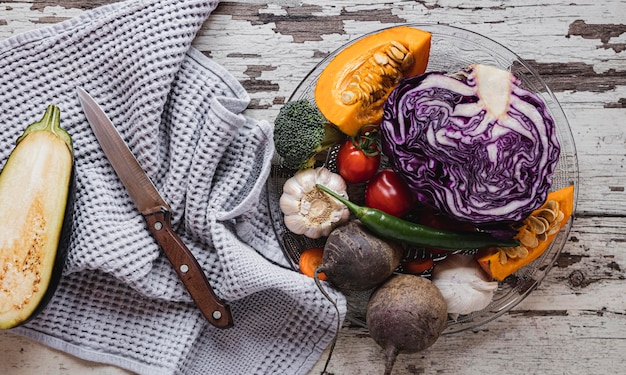 Top view assortment of veggies and cloth