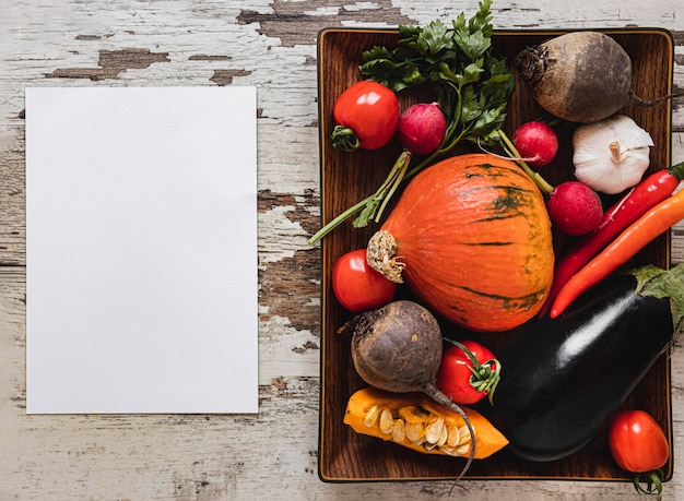 Top view assortment of veggies copy space paper