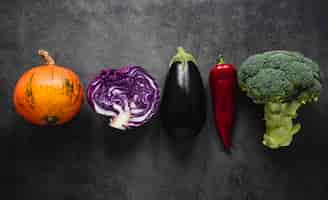 Free photo top view assortment of veggies in a line