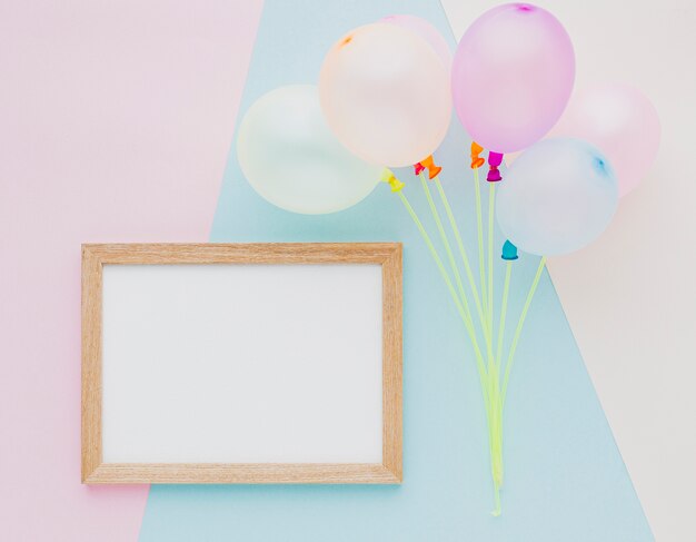 Top view assortment with balloons and frame