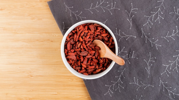 Top view assortment with bowl full of dried berries