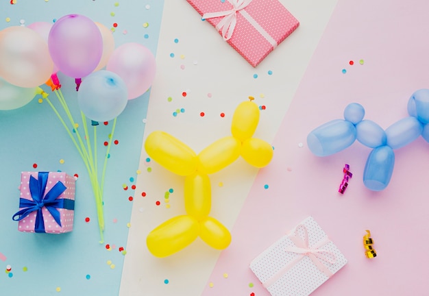 Top view assortment with colorful balloons and confetti