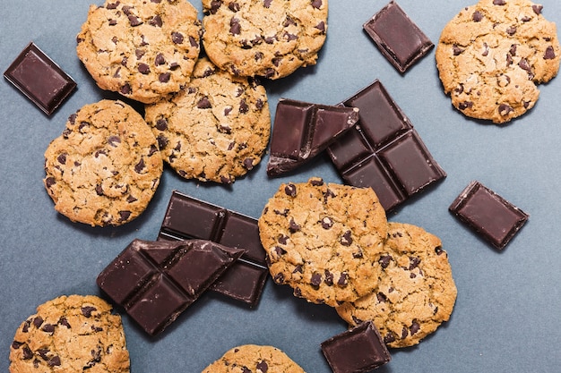 Top view assortment with cookies and dark chocolate