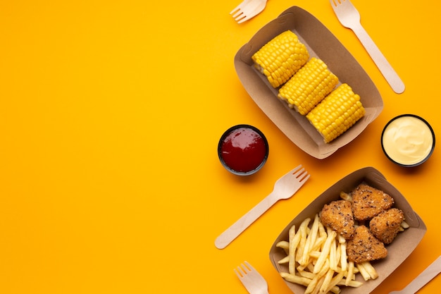 Top view assortment with fries, crispy and corn 