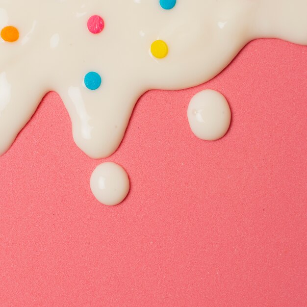 Top view assortment with milk and cereal on pink background