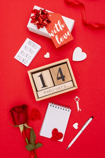 Top view assortment with presents on red background