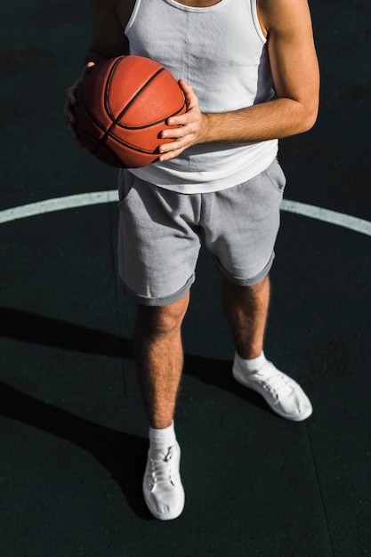 Free photo top view of athlete holding basketball