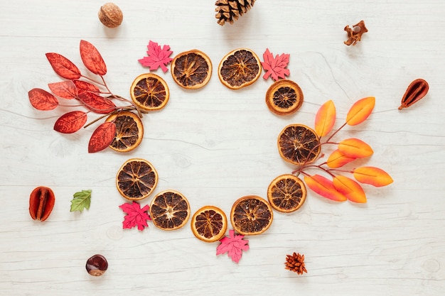 Top view autumn arrangement on wooden background