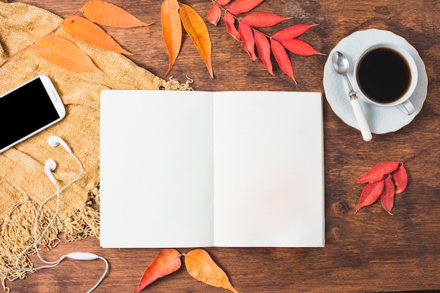 Top view autumn composition with opened notebook