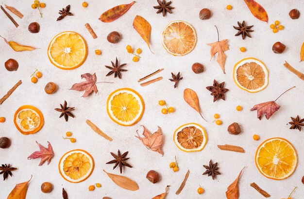 Top view of autumn elements with leaves and citrus