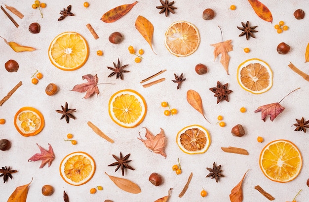 Top view of autumn elements with leaves and citrus