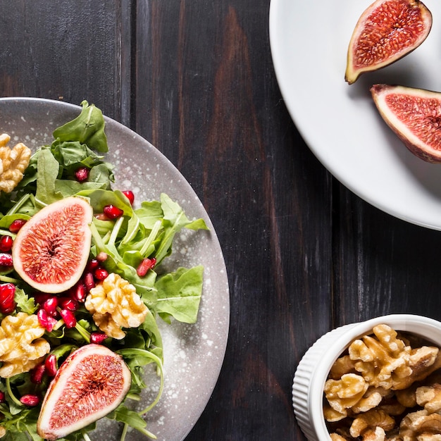 Top view of autumn fig salad with walnuts