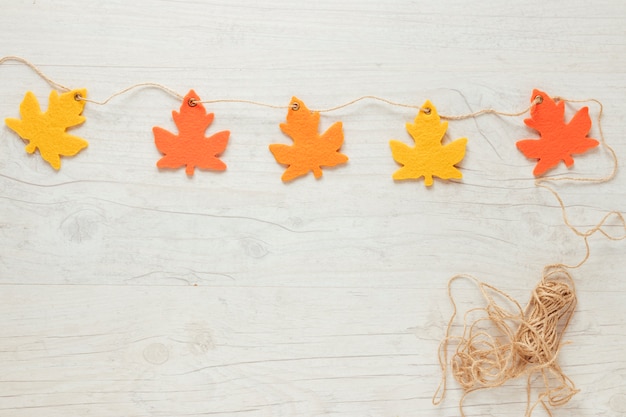 Top view autumn leaves ornaments on string