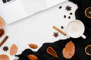 Free photo top view autumn leaves with coffee