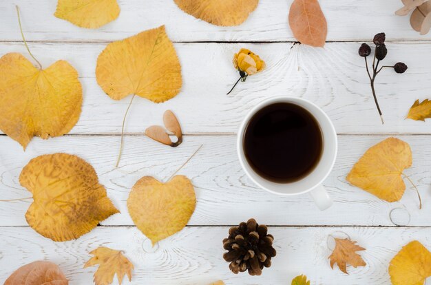 Top view autumn leaves with coffee