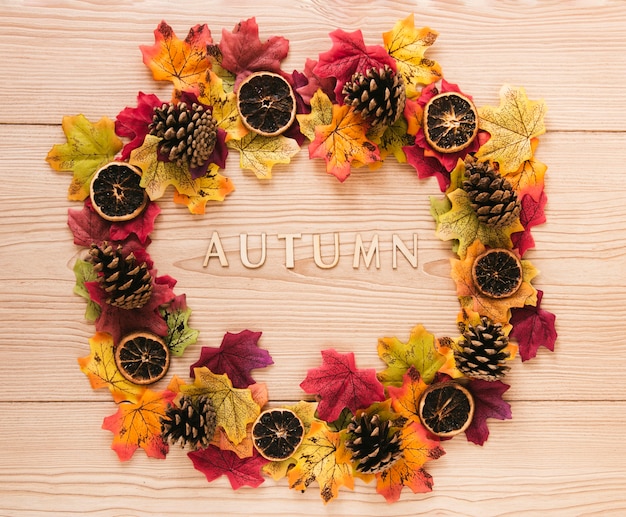 Top view autumn leaves on wooden table