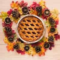 Free photo top view autumn pie with wooden background