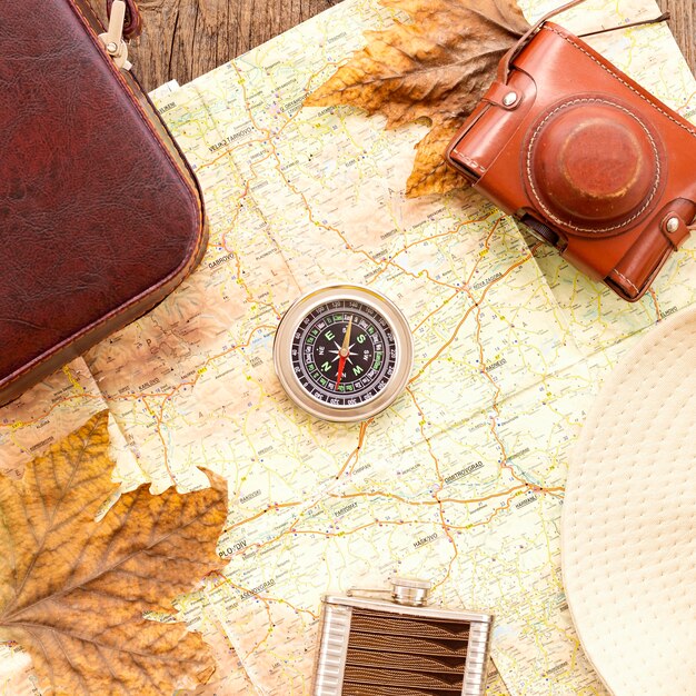 Top view autumn traveling arrangement with compass