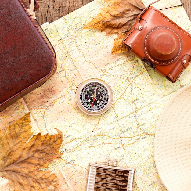 Top view autumn traveling arrangement with compass