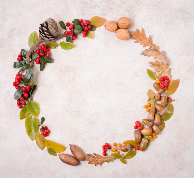 Top view of autumnal frame with leaves and pine cone