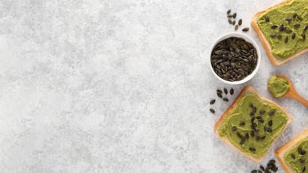 Top view avocado toast with seeds and copy-space