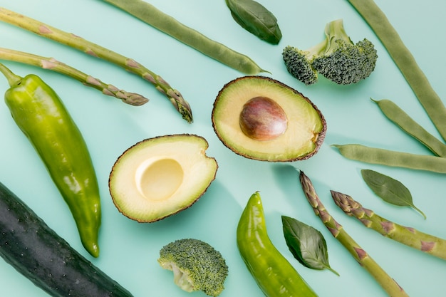 Top view of avocado with asparagus and spinach