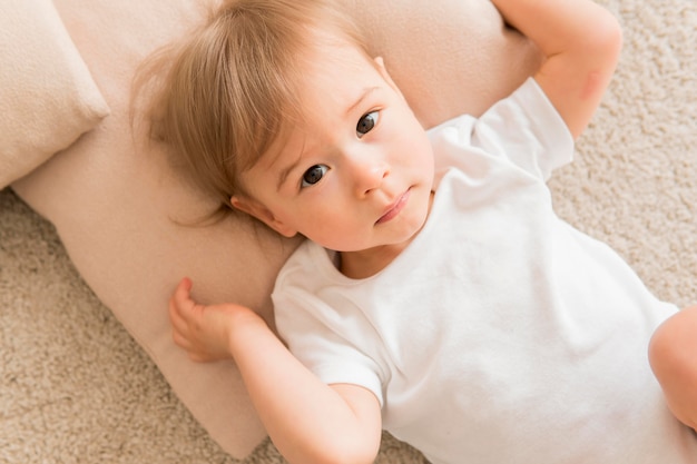 Free photo top view baby on pillow