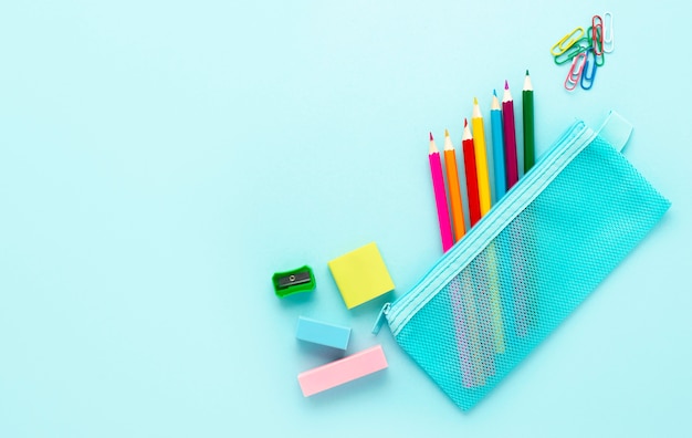 Free photo top view of back to school stationery with colorful pencils and copy space