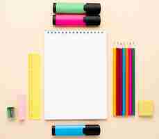 Free photo top view of back to school stationery with notebook and colored pencils