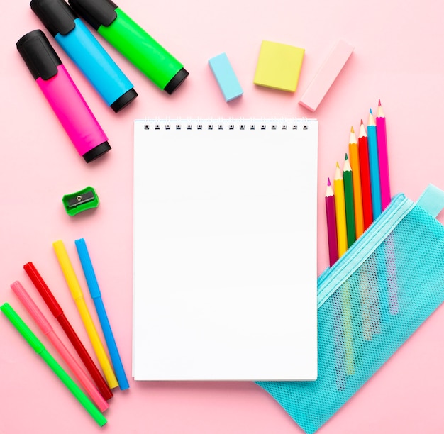 Free photo top view of back to school stationery with notebook