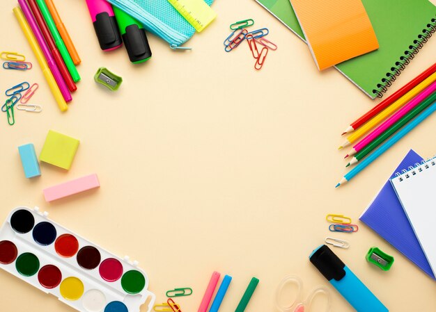 Top view of back to school stationery with pencils and watercolor
