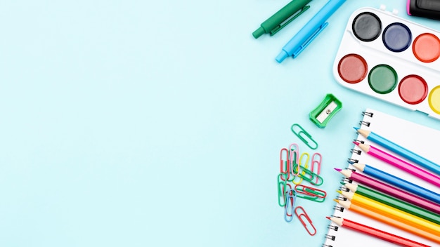 Top view of back to school stationery with watercolor and pencils