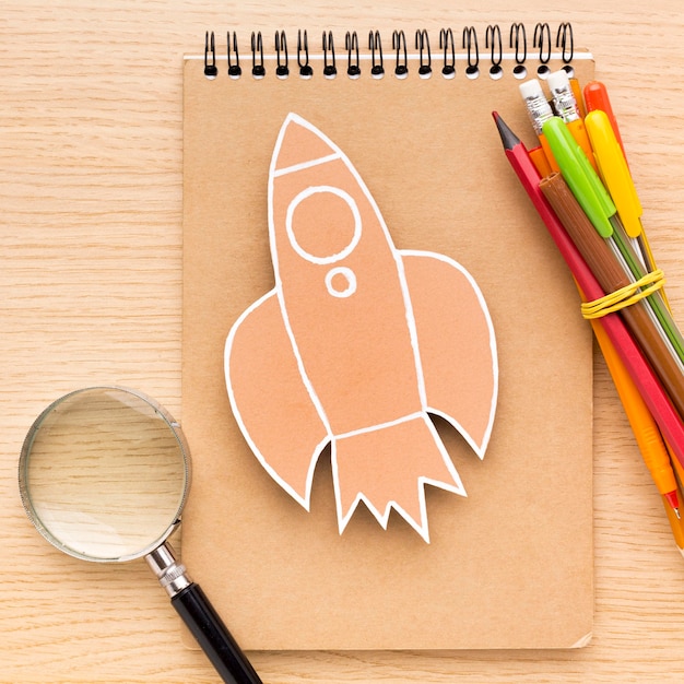 Top view of back to school supplies with notebook and pencils