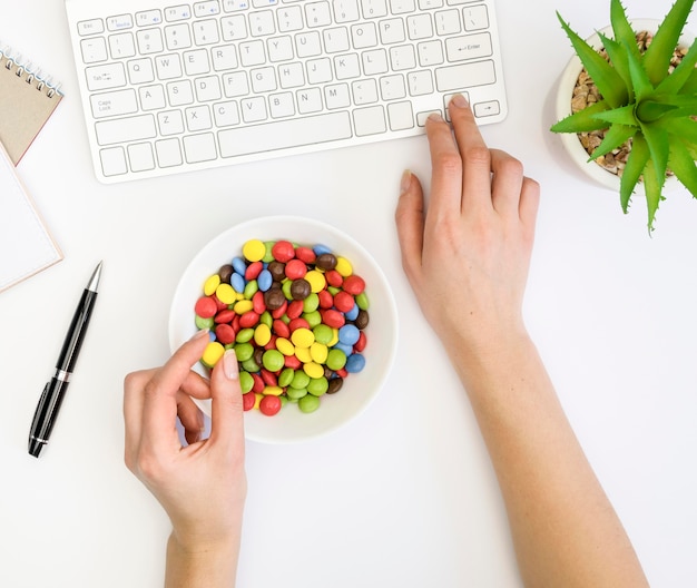 Top view of bad habit concept at desk