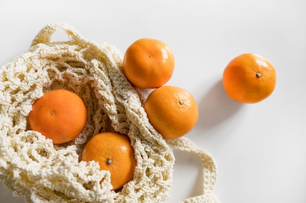 Top view bag with oranges arrangement