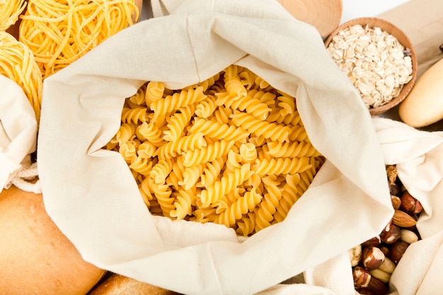 Top view of bag with pasta and assortment of nuts