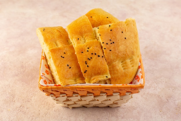 A top view baked bread hot tasty fresh sliced inside bread bin on pink