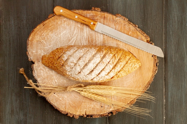 Top view baked bread with knife