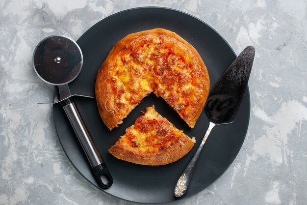 Top view baked delicious pizza sliced inside plate on white