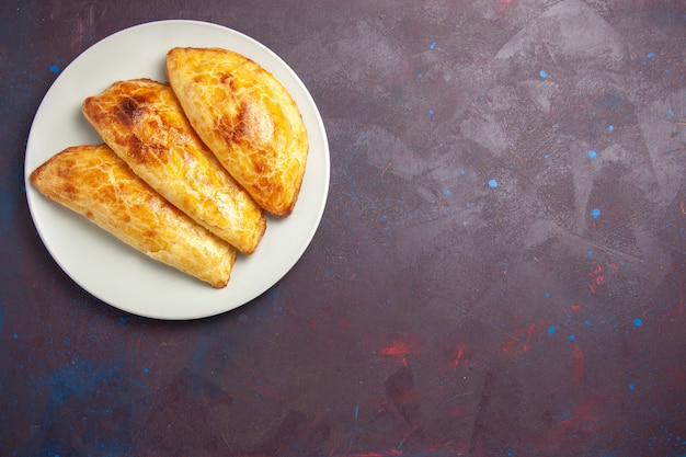 Free photo top view baked pastries bread like inside plate on dark space