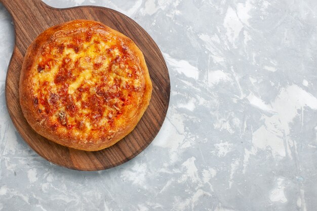 Top view baked pizza with cheese on white