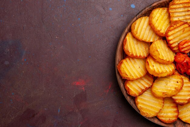 Top view baked potatoes with cooked vegetables on a dark space