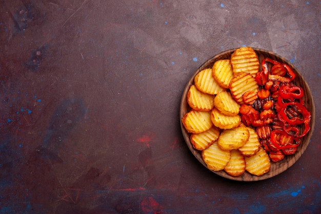 Top view baked potatoes with cooked vegetables on a dark space