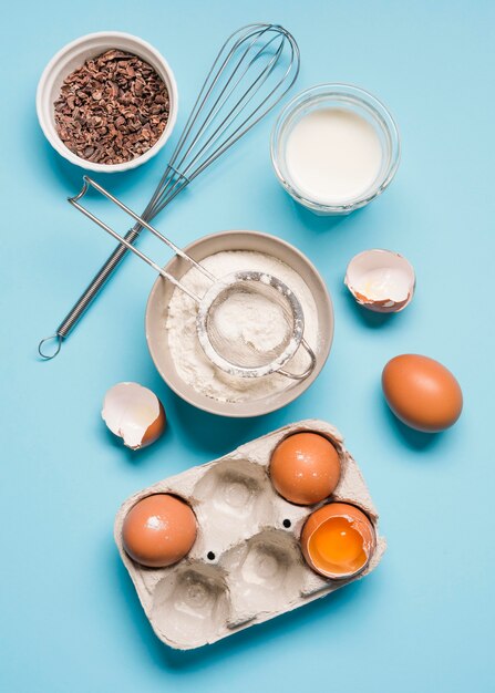 Top view baking flour with eggs on the table