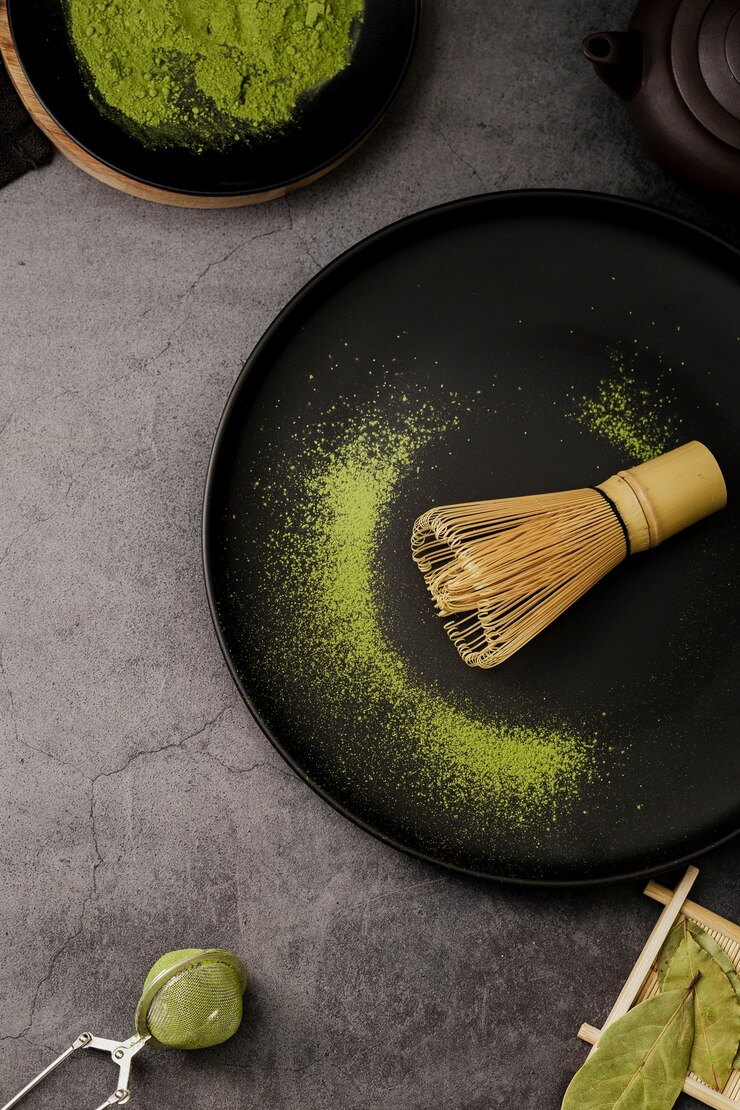 Free Photo top view of bamboo whisk on plate with sieve