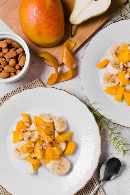 Top view of banana and mango on plates